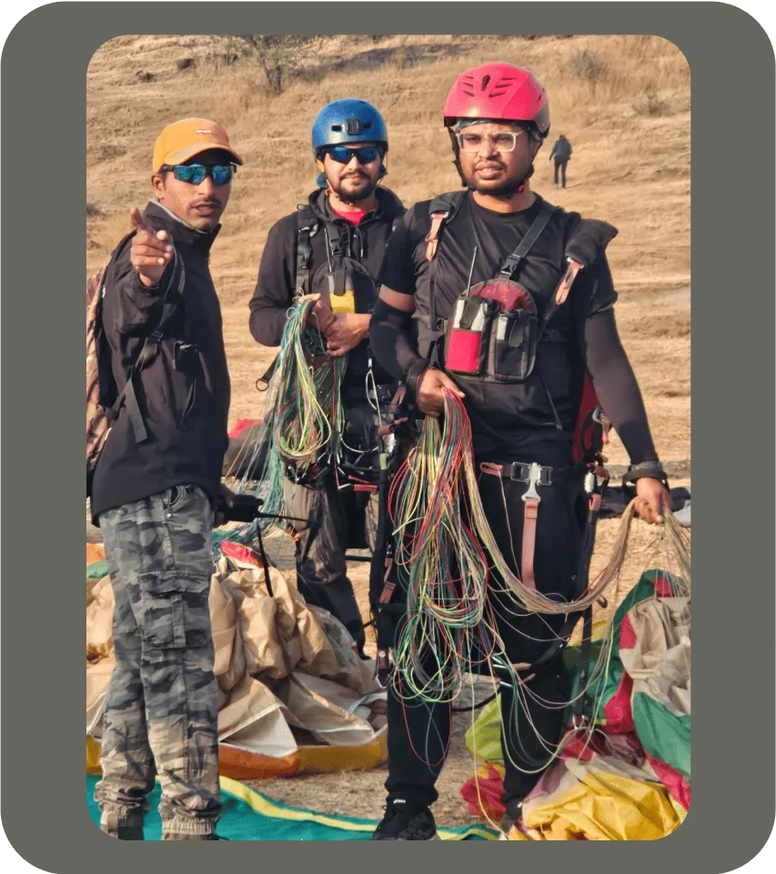 photo of one of paragliding instructor guiding me with my team member behind